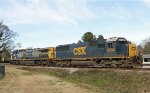 CSX 8536 & 228 are on one leg of the wye with a train passing behind it 